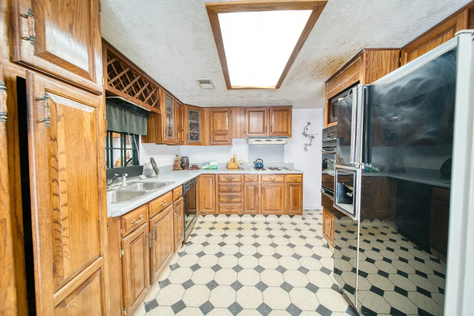 Dated kitchen with golden oak cabinets